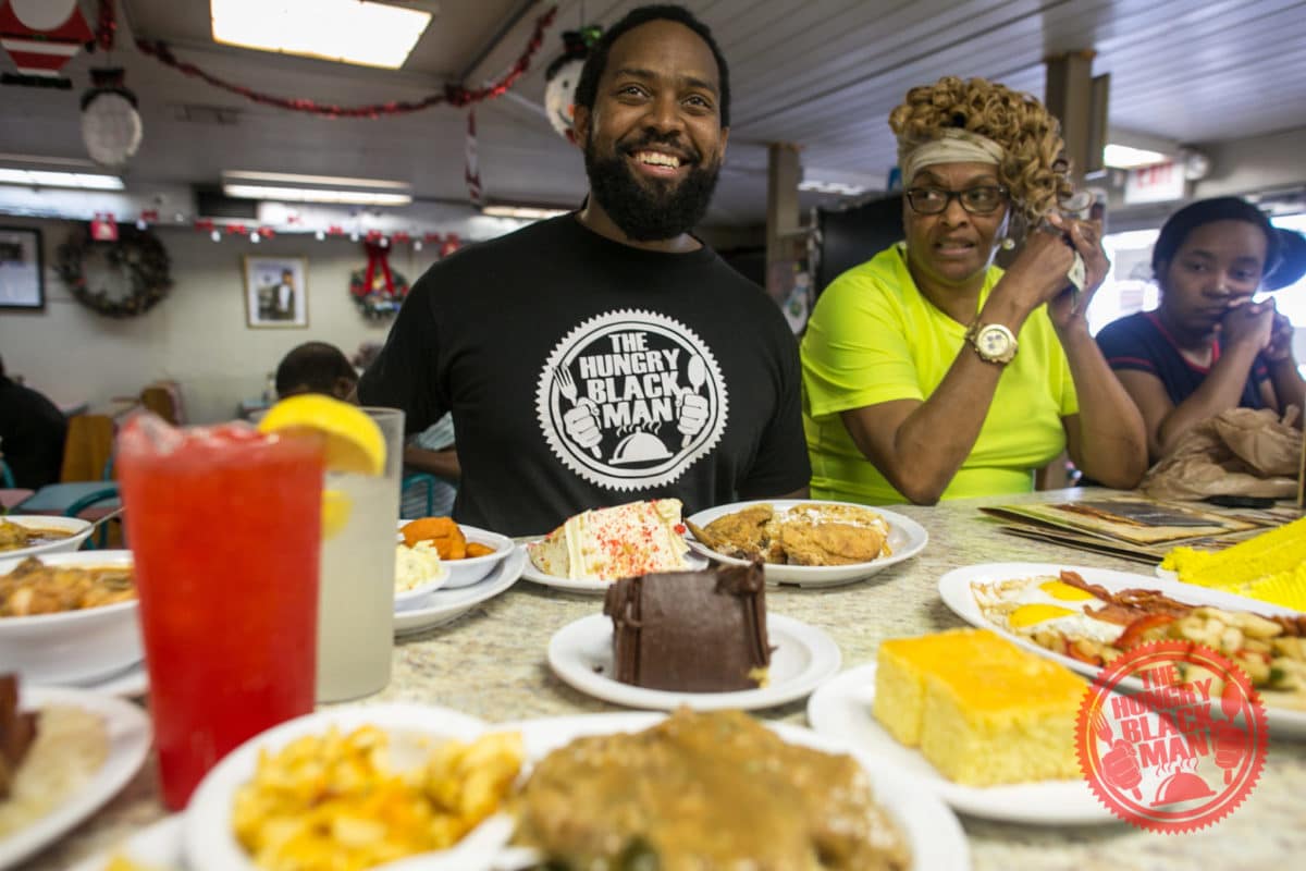 pastor-at-table-top-and-smiling