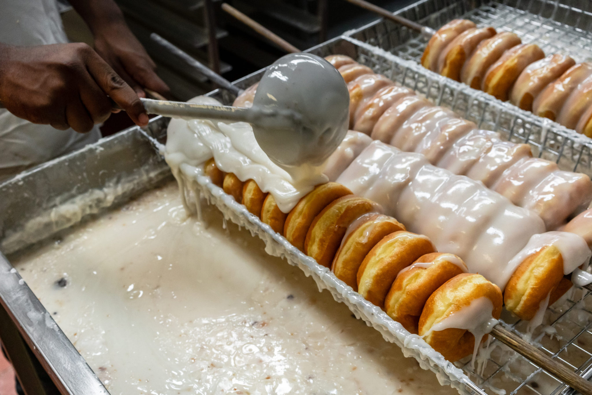 Donut being glazed